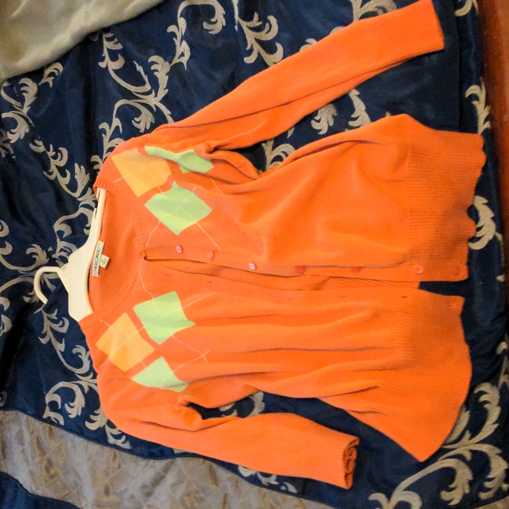 Checkered orange-coral colored cardigan